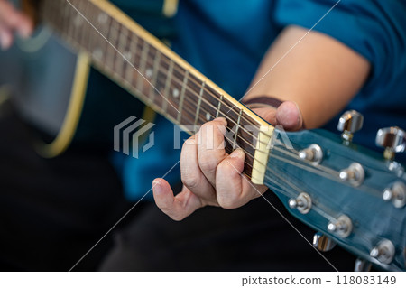 Guitar playing 118083149
