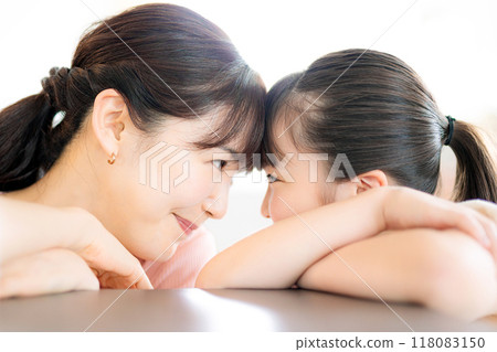 Parent and child staring together 118083150