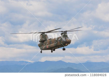 Japan Ground Self-Defense Force CH-47J Chinook flying through the mountains 118084028