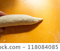 A photo of bread dough tapering 118084085