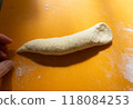 Dough that is wider on the right and narrower on the left 118084253
