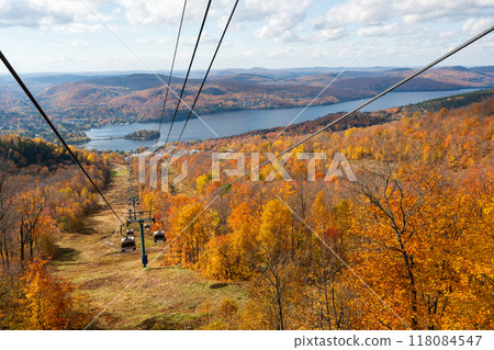 Mont Tremblant Ski Resort autumn scenery. Sightseeing by Panoramic Gondola cable car in sunny day. Mont-Tremblant, Quebec, Canada. Mont Tremblant Ski Resort autumn scenery. Sightseeing by Panoramic Gondola cable car in sunny day. Mont-Tremblant, Quebec, Canada. 118084547