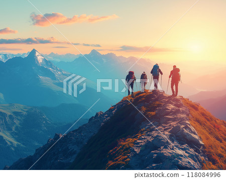 Hikers reaching a mountain summit with a breathtaking panoramic view. Show the hikers celebrating or taking in the view, with expansive mountain ranges and a clear sky in the background. The scene sho 118084996