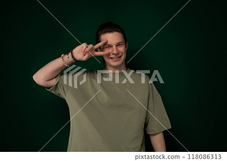 Man Making a Peace Sign With His Fingers 118086313