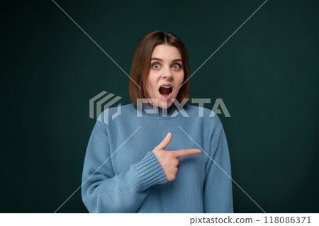 Woman in Blue Sweater Making Funny Face Woman in Blue Sweater Making Funny Face 118086371