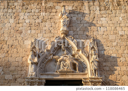 Architecture details at Church of St Saviour of the Franciscan friary at Stradun, the main street of Old town Dubrovnik, Croatia 118086465