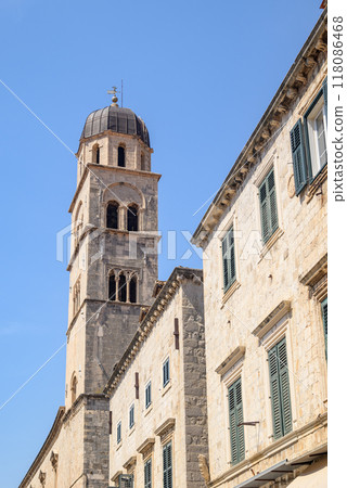 Church and bell tower of the Franciscan friary situated at the Stradun, the main street of Old town Dubrovnik in Croatia Church and bell tower of the Franciscan friary situated at the Stradun, the main street of Old town Dubrovnik in Croatia 118086468
