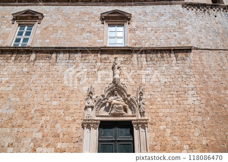 Church and bell tower of the Franciscan friary situated at the Stradun, the main street of Old town Dubrovnik in Croatia 118086470