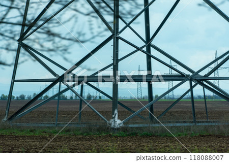 High voltage towers with sky background. Power line support with wires for electricity transmission. High voltage grid tower with wire cable at distribution station. Energy industry, energy saving High voltage towers with sky background. Power line support with wires for electricity transmission. High voltage grid tower with wire cable at distribution station. Energy industry, energy saving 118088007