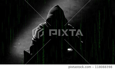 Anonymous man in a hood interview background, mysterious man sitting on a chair and talking. Anonymous hacker interview with no visible face, computer hacker conceptual background 118088398
