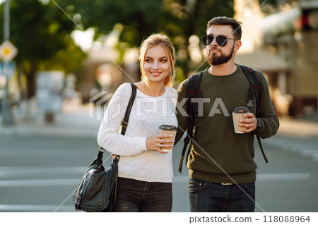 Stylish couple in love outdoors and drinking coffee. Youth, love, time together, lifestyle. 118088964