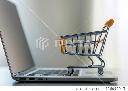 Online shopping e-commerce and customer experience concept. Cute Shopping cart on a laptop keyboard, depict shopper consumers buy or purchase goods and services at home or office 118090045