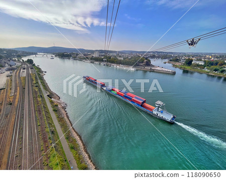 A cargo ship sailing along the Rhine in Koblenz, Germany A cargo ship sailing along the Rhine in Koblenz, Germany 118090650