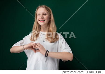 Woman Standing in Front of Green Wall 118091303