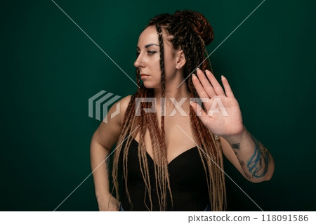 Woman With Dreadlocks Holding Her Hand Up Woman With Dreadlocks Holding Her Hand Up 118091586