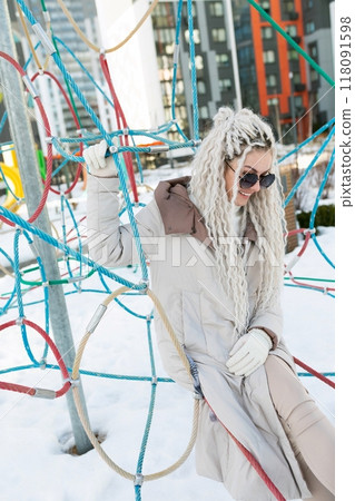 Woman With Long White Hair and Sunglasses Woman With Long White Hair and Sunglasses 118091598