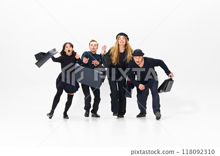 Emotional shopping activity during mega sales season, Group of people all in black outfit running with shopping bags forward Emotional shopping activity during mega sales season, Group of people all in black outfit running with shopping bags forward 118092310