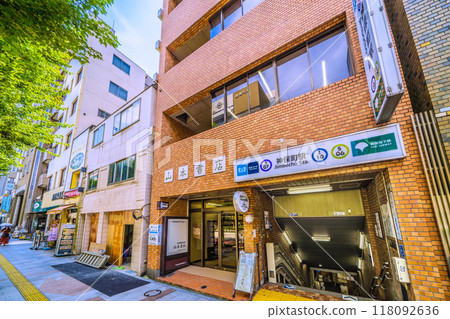 Tokyo cityscape in Japan: Kanda Jinbocho, a used bookstore district lined with shops facing north, Jimbocho Station. A bar is located under the stairs... = September 6th Tokyo cityscape in Japan: Kanda Jinbocho, a used bookstore district lined with shops facing north, Jimbocho Station. A bar is located under the stairs... = September 6th 118092636