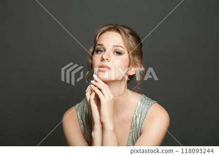 Glamorous female model with healthy skin, natural makeup and perfect updo hairstyle Glamorous female model with healthy skin, natural makeup and perfect updo hairstyle 118093244