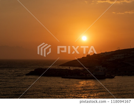 Beautiful sunset over the Aegean Sea at the Island Donousa, Greece. Beautiful sunset over the Aegean Sea at the Island Donousa, Greece. 118094167