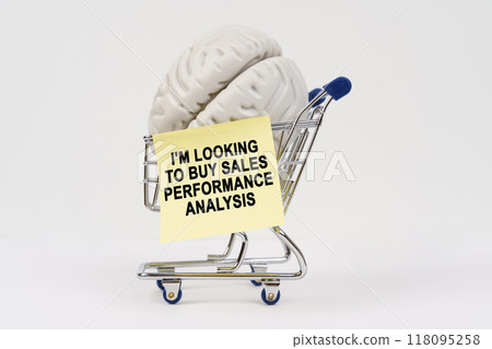 A shopping cart with a brain and a note seeking sales performance analysis 118095258