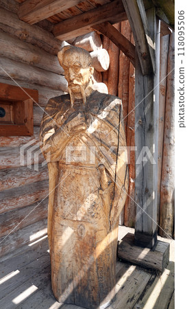 Kiev, Ukraine June 19, 2021: Figures of people and animals carved from wood - entertainment complex Kievan Rus 118095506