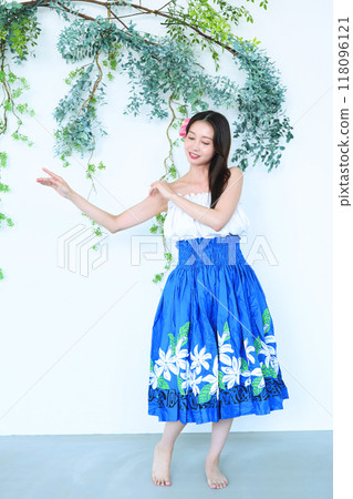 A woman dancing hula 118096121