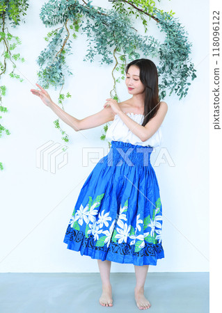 A woman dancing hula A woman dancing hula 118096122