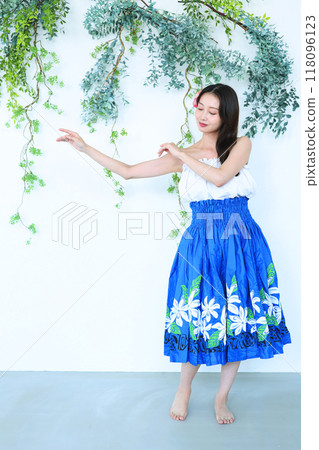 A woman dancing hula A woman dancing hula 118096123