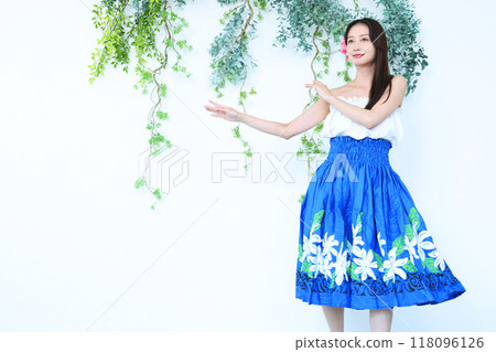 A woman dancing hula A woman dancing hula 118096126