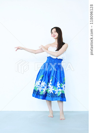A woman dancing hula A woman dancing hula 118096128