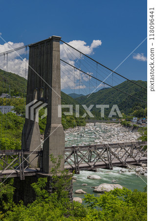 Momosuke Bridge, also known as Momo no Hashi, over the Kiso River in Minami Kiso Town, Kiso District, Nagano Prefecture, Japan 118096441