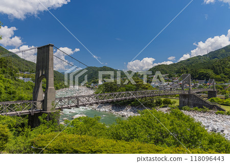 Momosuke Bridge, also known as Momo no Hashi, over the Kiso River in Minami Kiso Town, Kiso District, Nagano Prefecture, Japan Momosuke Bridge, also known as Momo no Hashi, over the Kiso River in Minami Kiso Town, Kiso District, Nagano Prefecture, Japan 118096443