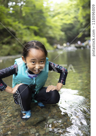 Girls playing on the river 118096809