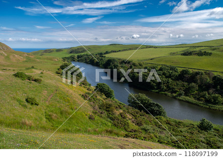 Rural Landscape With Lake Mire Loch At The Atlantic Coast Of St. Abbs Head In Scotland, UK Rural Landscape With Lake Mire Loch At The Atlantic Coast Of St. Abbs Head In Scotland, UK 118097199