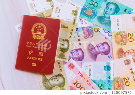 Authentic passport of People Republic of China containing Chinese cash yuan banknotes various denominations 118097575