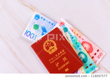 Passport issued by People Republic of China with Chinese yuan cash money in various denominations Passport issued by People Republic of China with Chinese yuan cash money in various denominations 118097577