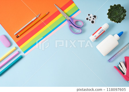 Frame made of paper cutting tools, scissors, cutter, cutting mat and colored paper. DIY, handicraft concept. Flat lay, copyspace Frame made of paper cutting tools, scissors, cutter, cutting mat and colored paper. DIY, handicraft concept. Flat lay, copyspace 118097605