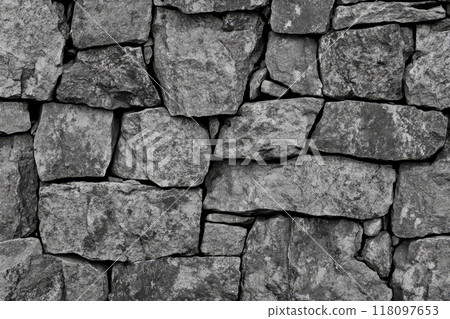 Rough stone wall. Rugged texture of the stacked blocks 118097653