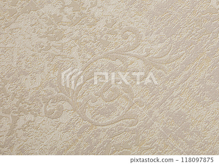 Background of beige wallpaper or plaster wall with vintage swirl pattern. 118097875