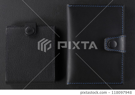 Black leather wallet on a black background. 118097948