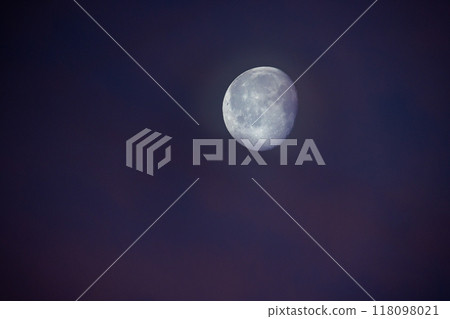 The Serene Moon Illuminates the Twilight Sky, Creating a Peaceful and Dreamy Atmosphere The Serene Moon Illuminates the Twilight Sky, Creating a Peaceful and Dreamy Atmosphere 118098021