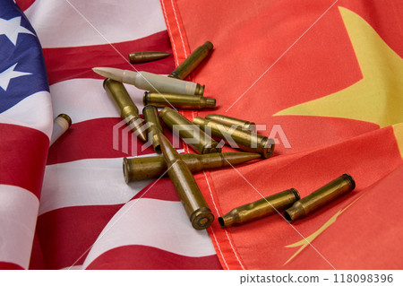 American and Chinese flags with rifle bullets scattered. American and Chinese flags with rifle bullets scattered. 118098396