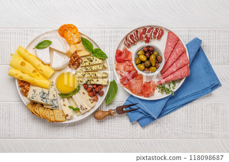 A selection of various cheeses and meats 118098687