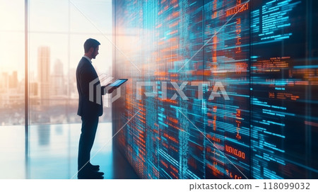 Businessman holding a tablet while analyzing digital code data in a high-tech workspace. Represents coding and IT integration 118099032