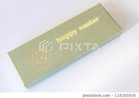 A box of chocolate eggs with the inscription in English Happy Easter. A box of chocolate eggs with the inscription in English Happy Easter. 118101650