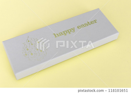 A box of chocolate eggs with the inscription in English Happy Easter. A box of chocolate eggs with the inscription in English Happy Easter. 118101651