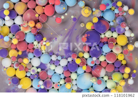 Colorful abstract arrangement of floating paint droplets on a surface creating vibrant patterns in a creative art setting 118101962