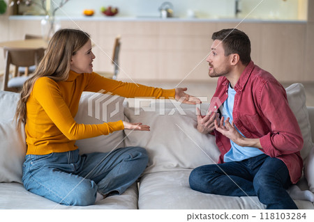 Excited man, passionate woman actively arguing, discussing, debating, chatting, communicating. Excited man, passionate woman actively arguing, discussing, debating, chatting, communicating. 118103284