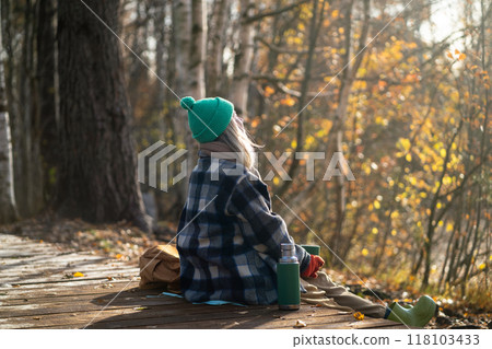 Serene woman backpacker meditating on eco trail, watching natural landscape in sunny fall woods Serene woman backpacker meditating on eco trail, watching natural landscape in sunny fall woods 118103433